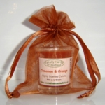  The three wise men Gold organza gift bag,
 with a cinnamon and orange candle in a glass. 